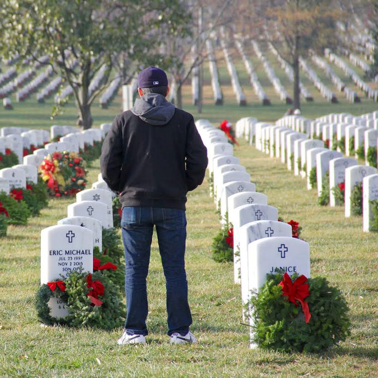 volunteer in cemetery for wreaths 