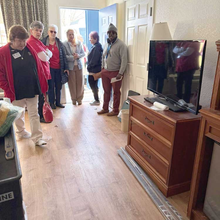 members looking at room for homeless 