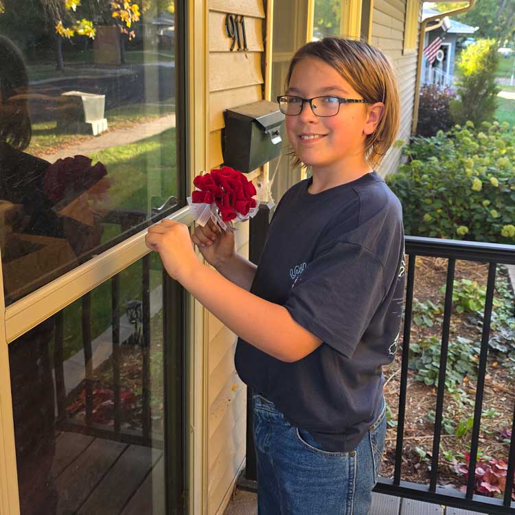 boy holding poppy flower