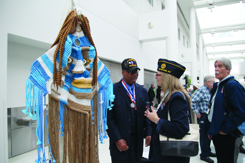 Charles Marshall discusses his art with a Legion Family member (2017 NVCAF).